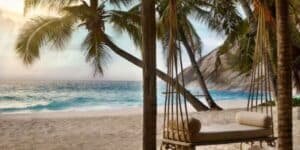 If you’re eco-conscious yet craving opulence, North Island in Seychelles offers the perfect mix. Its preservation initiatives go hand-in-hand with luxury, blending sustainable design with breathtaking accommodations. You’ll stay in private villas built using local materials, seamlessly integrating nature into the experience.